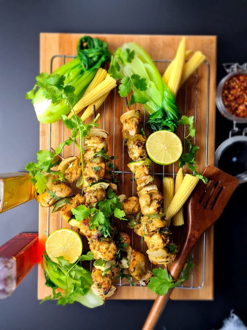 Thai chicken kebabs laid out on tray